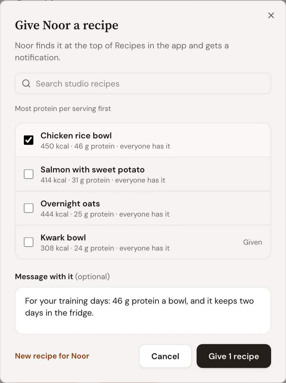 Give Noor a recipe in Trainnode: studio recipes sorted by most protein per serving, the chicken rice bowl picked, a message, and Give 1 recipe.