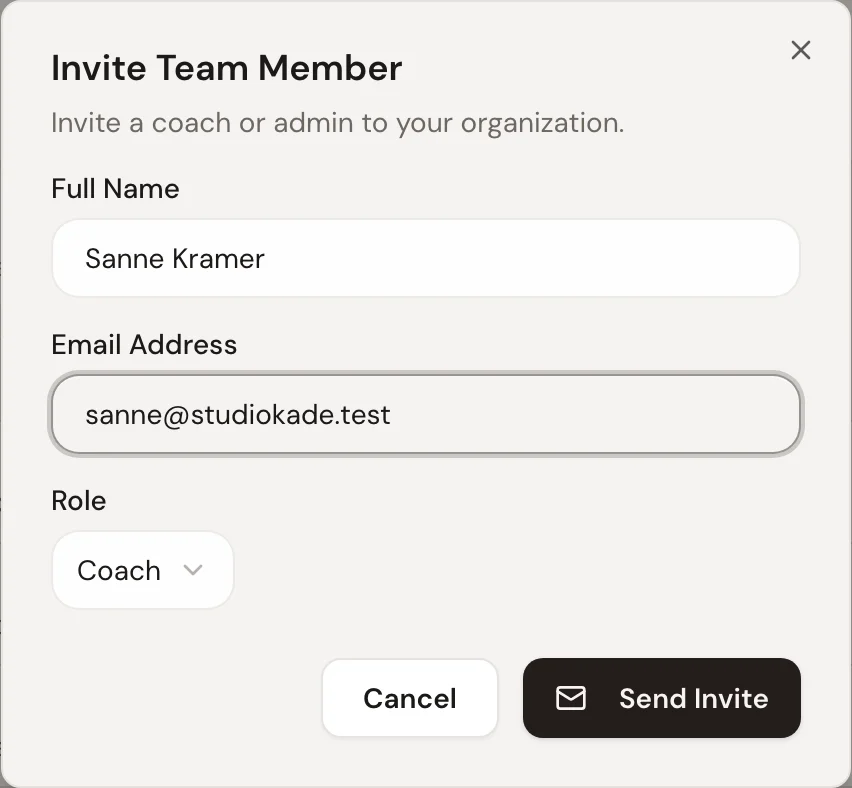 Inviting a team member in Trainnode: Sanne Kramer, sanne@studiokade.test, with the role Coach.